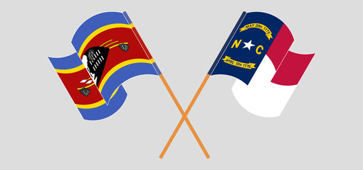 Crossed and waving flags of Eswatini and The State of North Carolina