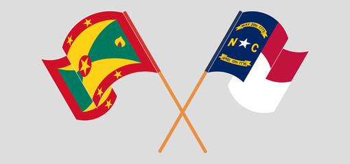 Crossed and waving flags of Grenada and The State of North Carolina