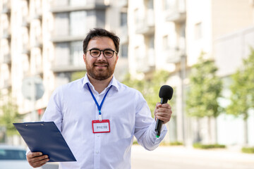 journalist brunette young professional journalist reporting news on television smiling