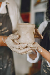 Adult senior couple at artwork in pottery