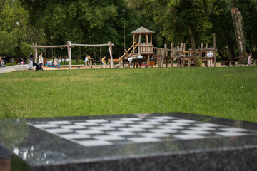 Chess in the park in Lublin, Poland. - obrazy, fototapety, plakaty