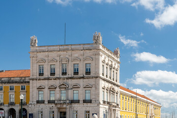 Fototapeta na wymiar Lisboa, Portugal. April 9, 2022: Commerce square with sculpture with blue sky.
