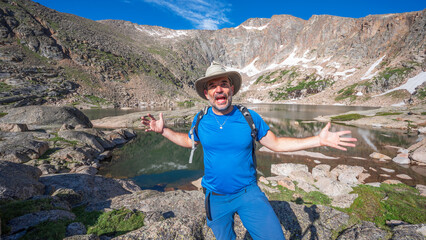 Naklejka premium Happy Hiker at Crystal Lake in Rocky Mountain National Park Colorado
