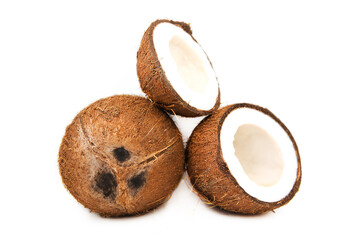 Two coconut one of which split isolated on white background.