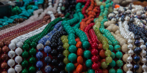 Multi-colored stones with beads closeup.