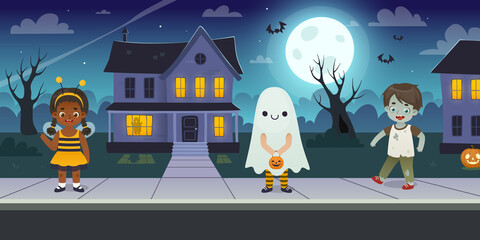 Cute children in halloween costume walking on the night street. Dressed up cartoon kids on suburb sidewalk.