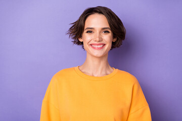 Portrait of charming cheerful lady toothy beaming smile wear sweater isolated on purple color background