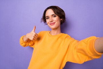 Portrait of adorable lady take selfie arm finger demonstrate thumb up approve isolated on purple...