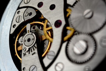 Clockwork. Macro shot of clock mechanism. Gears. Artistic blur