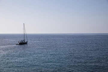 Fototapeta premium Mallorca, Spain - Boats in a cove in the mediterranean sea blue green color