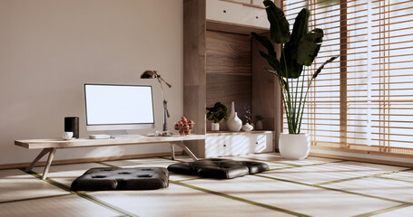 Living room interior on tatami mat floor, computer on low table and pillow.3D rendering