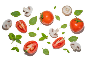 Mushrooms, tomato and basil isolated on white. Flatlay pattern on white background top view