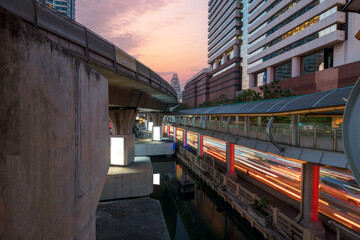 Naklejka premium A sunset scene in Bangkok illustrate multiple way of commuting in the citiy 