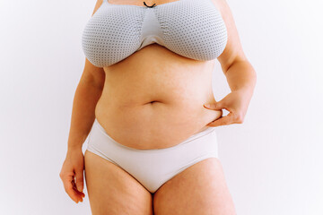 sagging skin with age spots on fat belly, plastic surgery concept