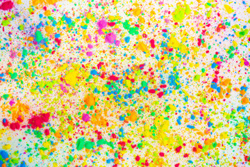 Happy Holi. A colorful festival of colored paints made from powder and dust. Colorful holi powder background. Holiday of bright colors Indian tradition.