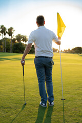 Side view of a professional golf player at golf club.