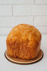 freshly baked homemade white bread with a crispy crust in the kitchen close-up