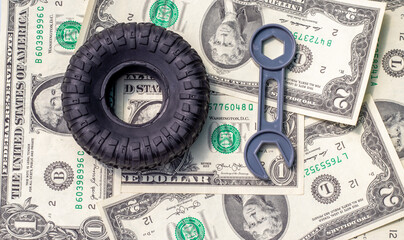 car repair and maintenance,tires replacement.one rubber black tire from toy car and grey little...