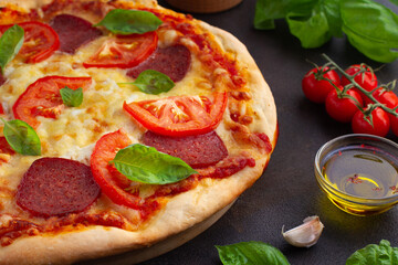 Pepperoni pizza with basil close-up