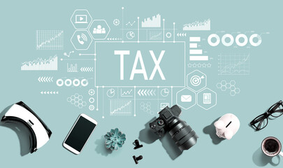 Tax theme with electronic gadgets and office supplies