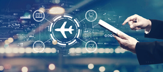 Flight ticket booking concept with businessman using a tablet