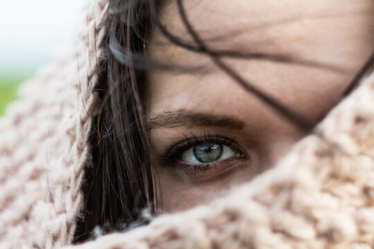 Close Up Portrait Of A Young Woman Eye. Winter Time Scraf Covered Face