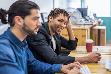 Focused multiethnic colleagues working in office