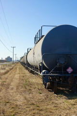Fototapeta na wymiar oil tanker cars on the tracks in the country