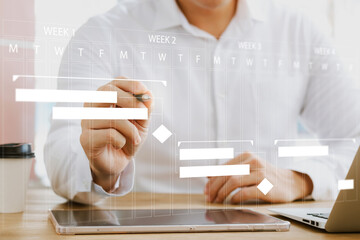 concept of time management and human resources Effectively, male businessman using a laptop computer Organizing work in a systematic way.