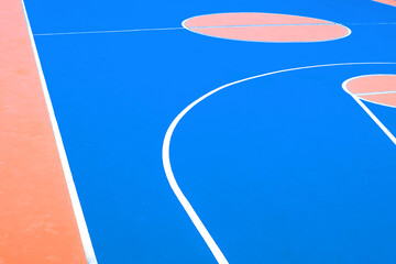 Basketball court closeup. Outdoor basketball field in bright colors.