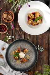 Composition of eastern dessert - baklava and honey cake on wooden background. Turkish baklava with nuts and honey cake in rustic style on wooden table. Pastry set in arabic style.