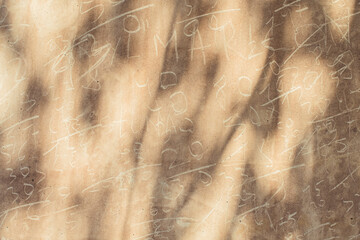 Grungy wall with scratches and numbers