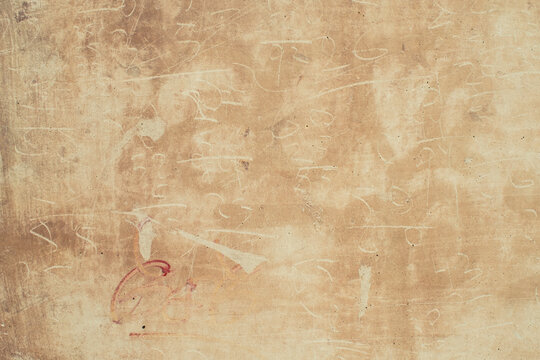 Grungy wall with scratches and numbers