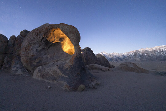 Rocky formations in wild nature in starry sky