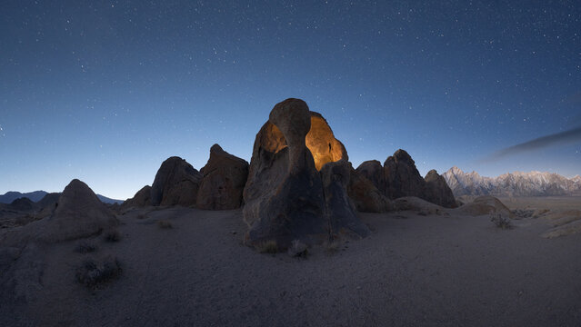 Rocky formations in wild nature in starry sky