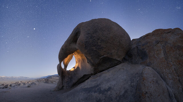 Rocky formations in wild nature in starry sky
