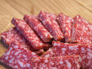 Delicious sausage with lard. Lots of sausage slices, a macro shot.