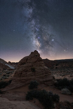 Stone on mountain with milky way on sky