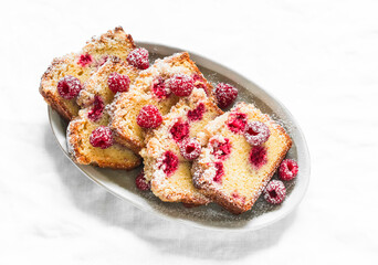Raspberry cake is a delicious summer dessert on a light background, top view
