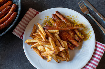Vienna sausages with homemade french fries and curry sauce