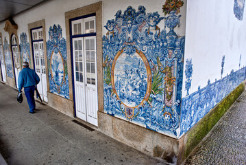 azulejos panels on the wall of the Rio Tinto train station suburb of Porto, Portugal - obrazy, fototapety, plakaty