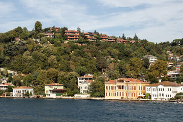 View of historical, traditional mansions by Bosphorus in Kandilli area of Asian side of Istanbul. It is a sunny summer day. Beautiful travel scene.