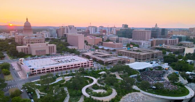 Sunset in Austin, Texas, with view of Capital building and Waterloo Park. Bird's eye view of the surrounding apartment buildings.