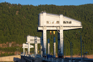 Giant cranes for adjusts the valves during floods on hydroelectric power station of Krasnoyarsk dam...