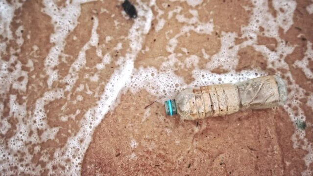The video above shows trash bottles being discarded at the beach.