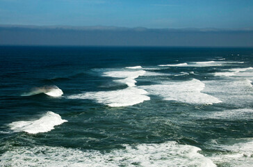 North beach in Nazaré, Portugal. Ocean with waves and surf