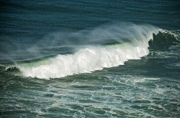North beach in Nazaré, Portugal. Ocean with waves and surf