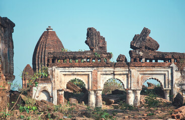 Dome of Pancharatna Hindu temple visible through ruined brick made structure of Panchakot royal palace & fort destroyed in Maratha invasion of Bengal in 1751 At Garh Panchakot in Purulia, West Bengal.