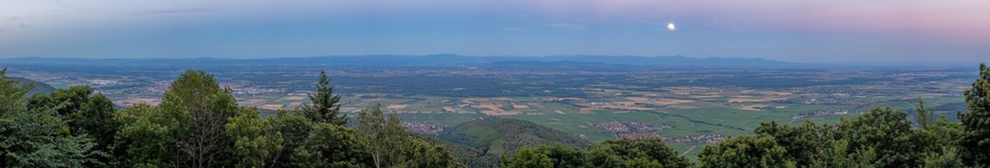 Fototapeta na wymiar Panoramic view over the Rhine valley in Alsace with rising full moon