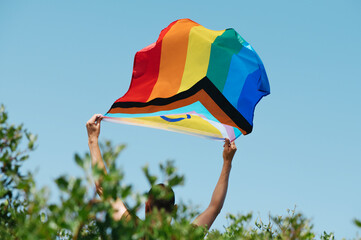 holding an intersex-inclusive progress pride flag